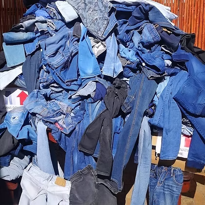 a pile of donated denim, waiting to be sorted